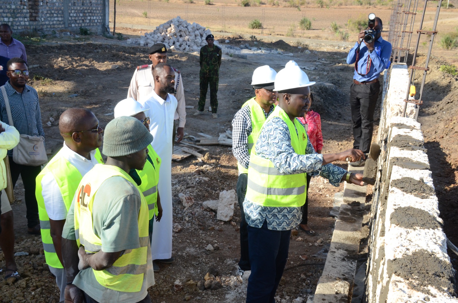 Senate Committee on Industry member Jackson Mandago tries out the walling of the Kwale County Aggregation and Industrial Park (CAIP), that is now at 50 percent construction. / Jared Nyabuti